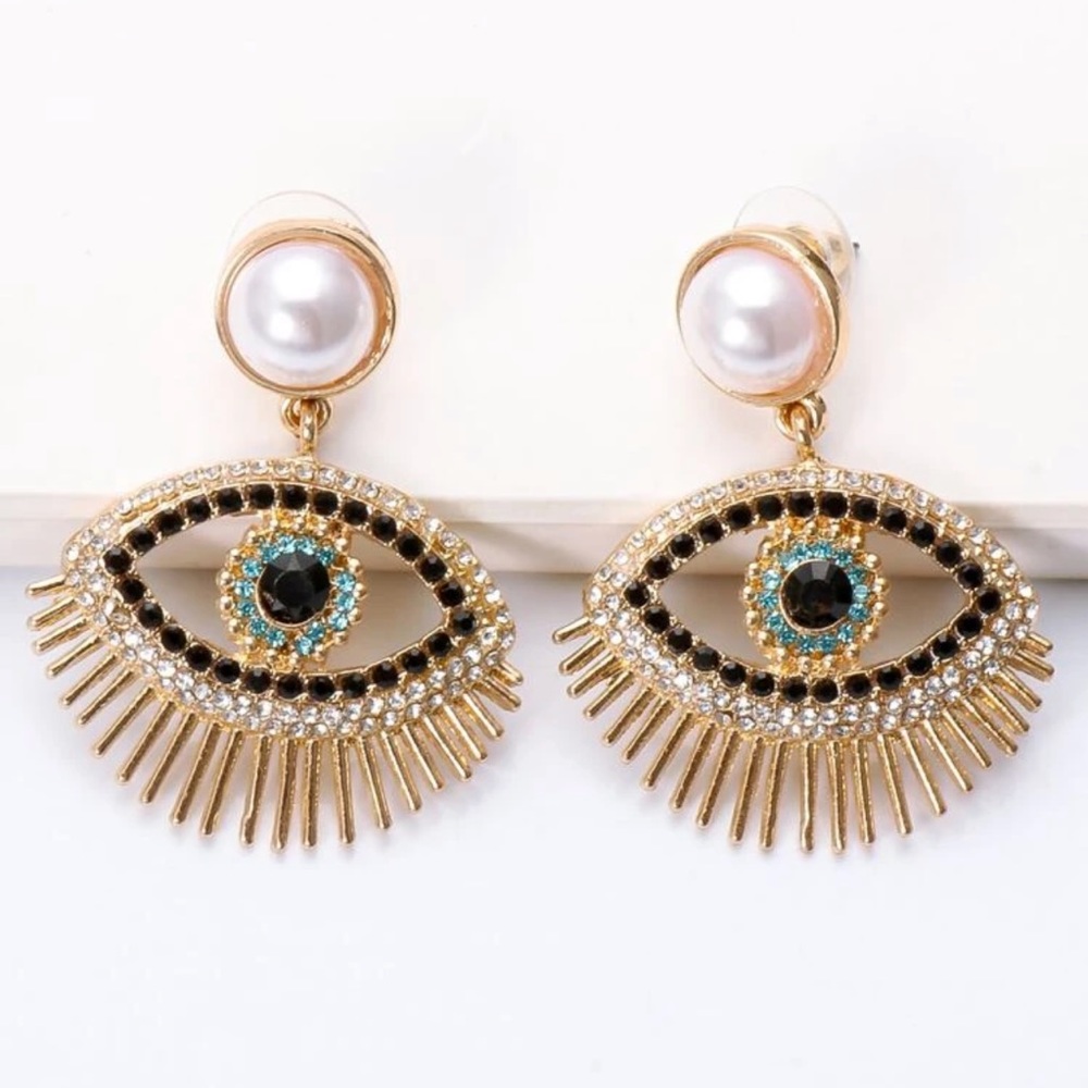 Pearl like evil eye earrings